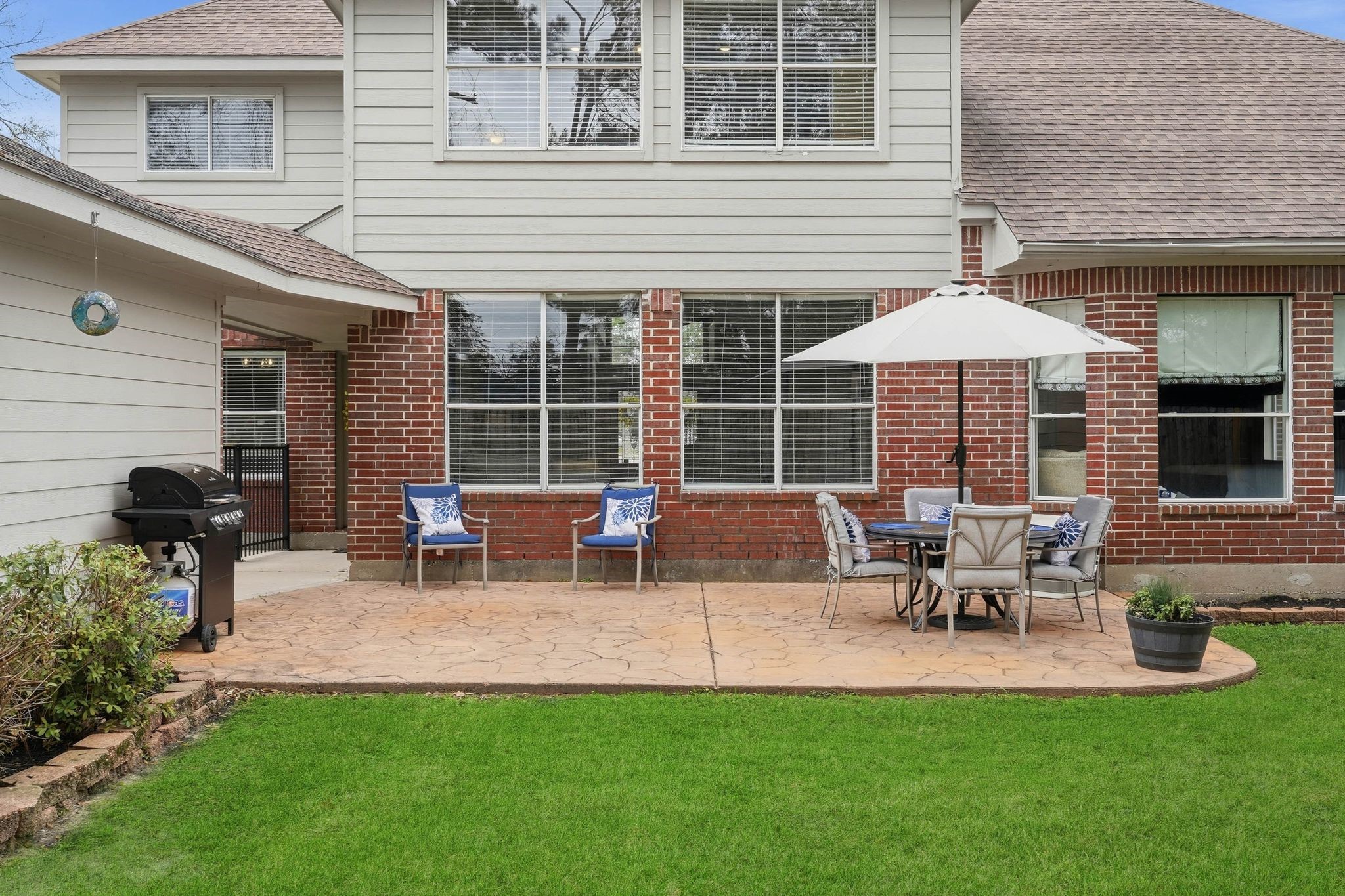 2515 Woodsboro Drive Spring, TX 77388 - Photo 40 of 44 This backyard features a spacious patio and a well-maintained lawn, perfect for outdoor entertaining.