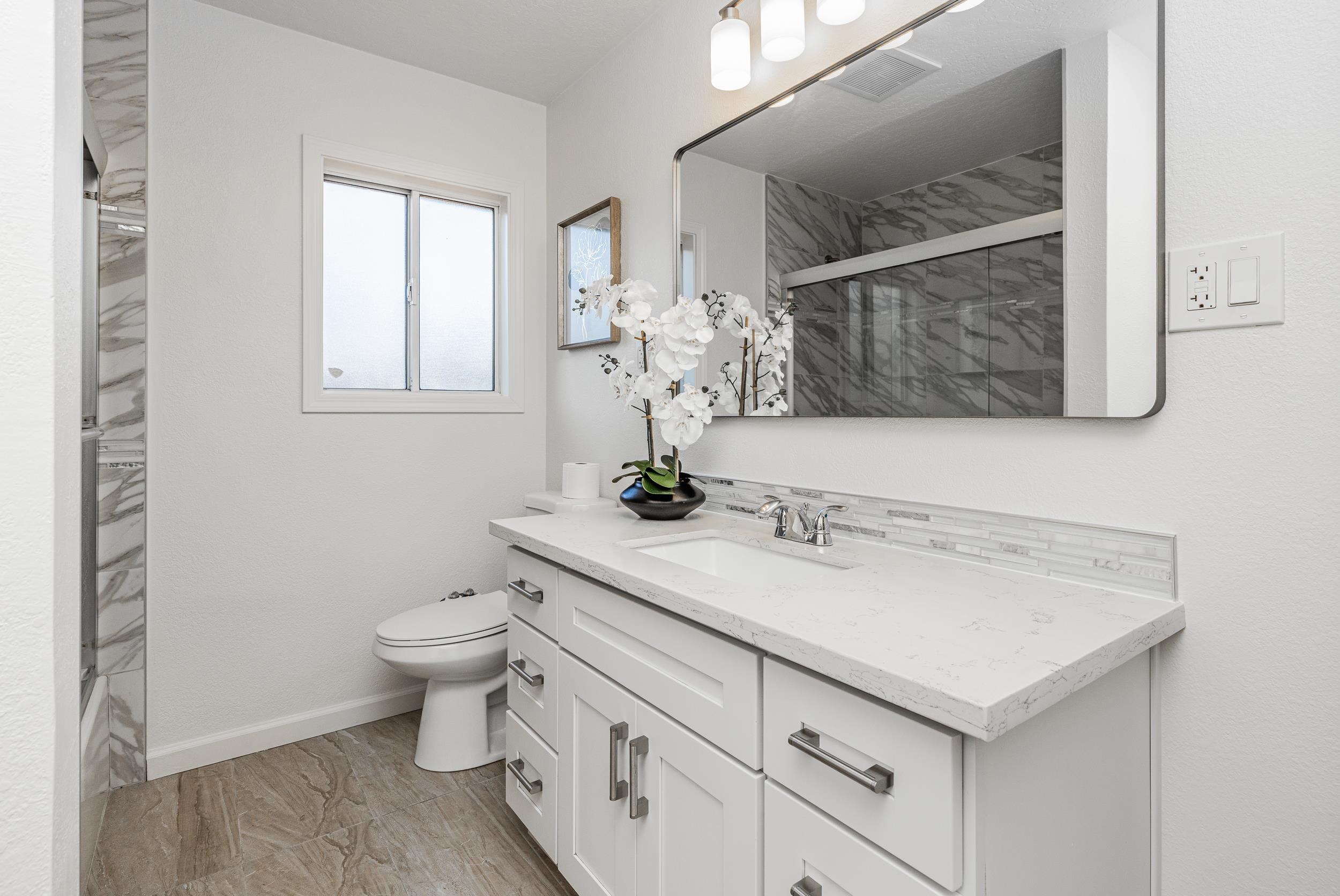 1900 Chestnut Street Santa Clara, CA 95054 - Photo 24 of 39 a bathroom with a sink toilet and window