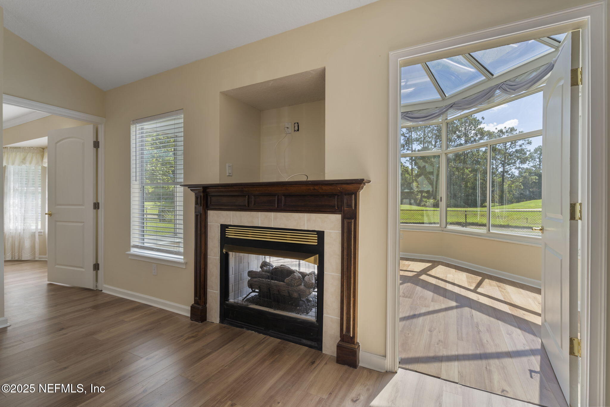 5673 Piper Glen Boulevard Jacksonville, FL 32222 - Photo 12 of 45 a view of a livingroom with a fireplace and window