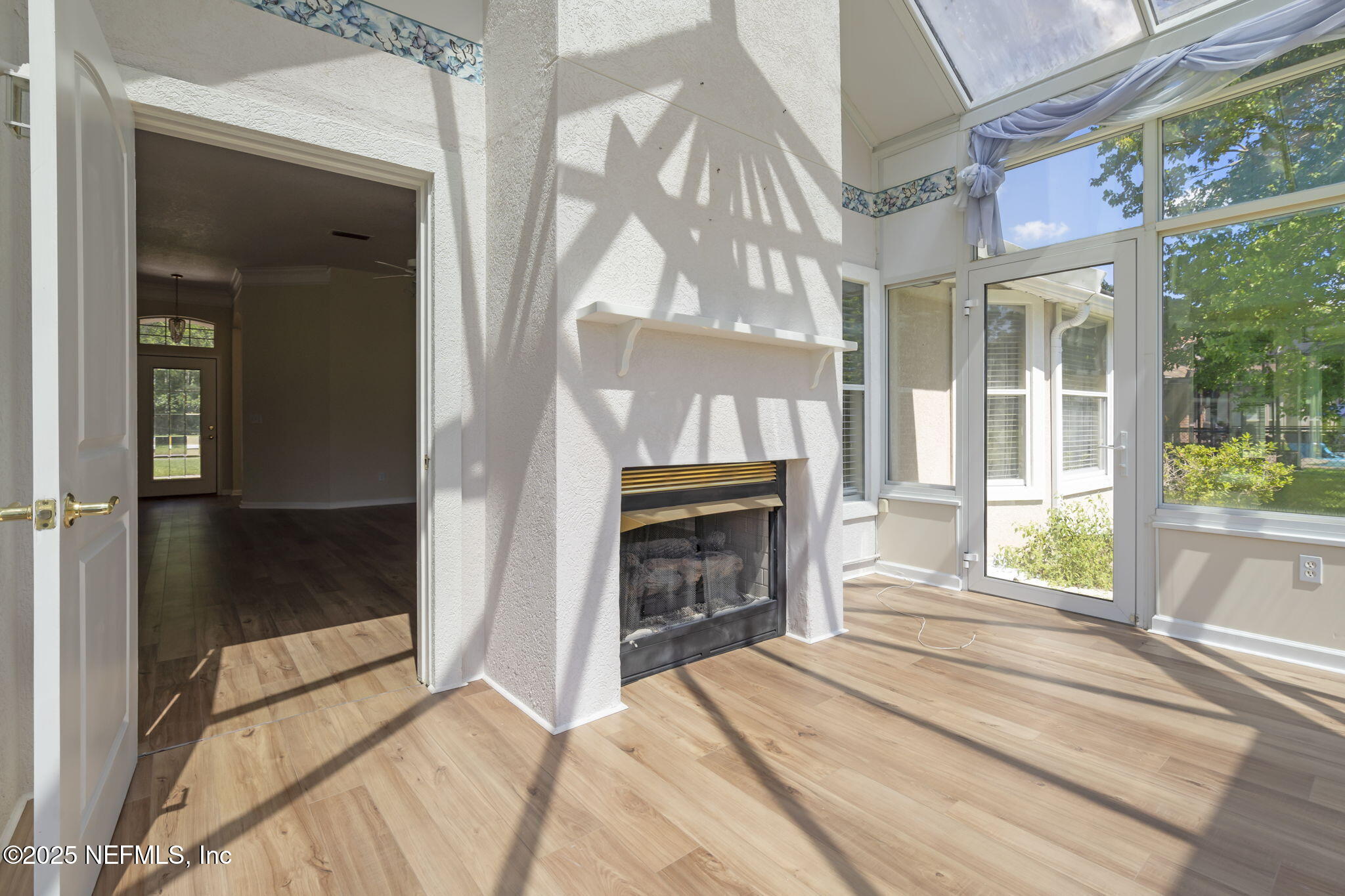 5673 Piper Glen Boulevard Jacksonville, FL 32222 - Photo 14 of 45 a bedroom with a bed and a fireplace