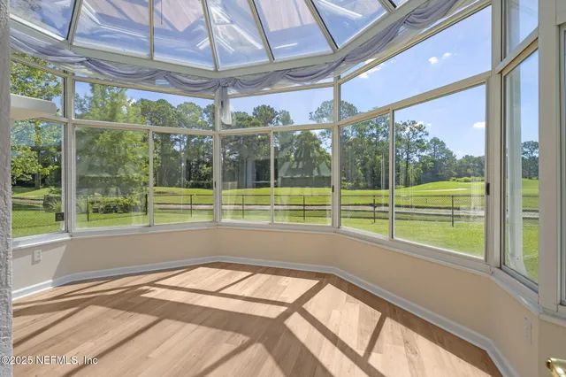 a view of a room with a large window