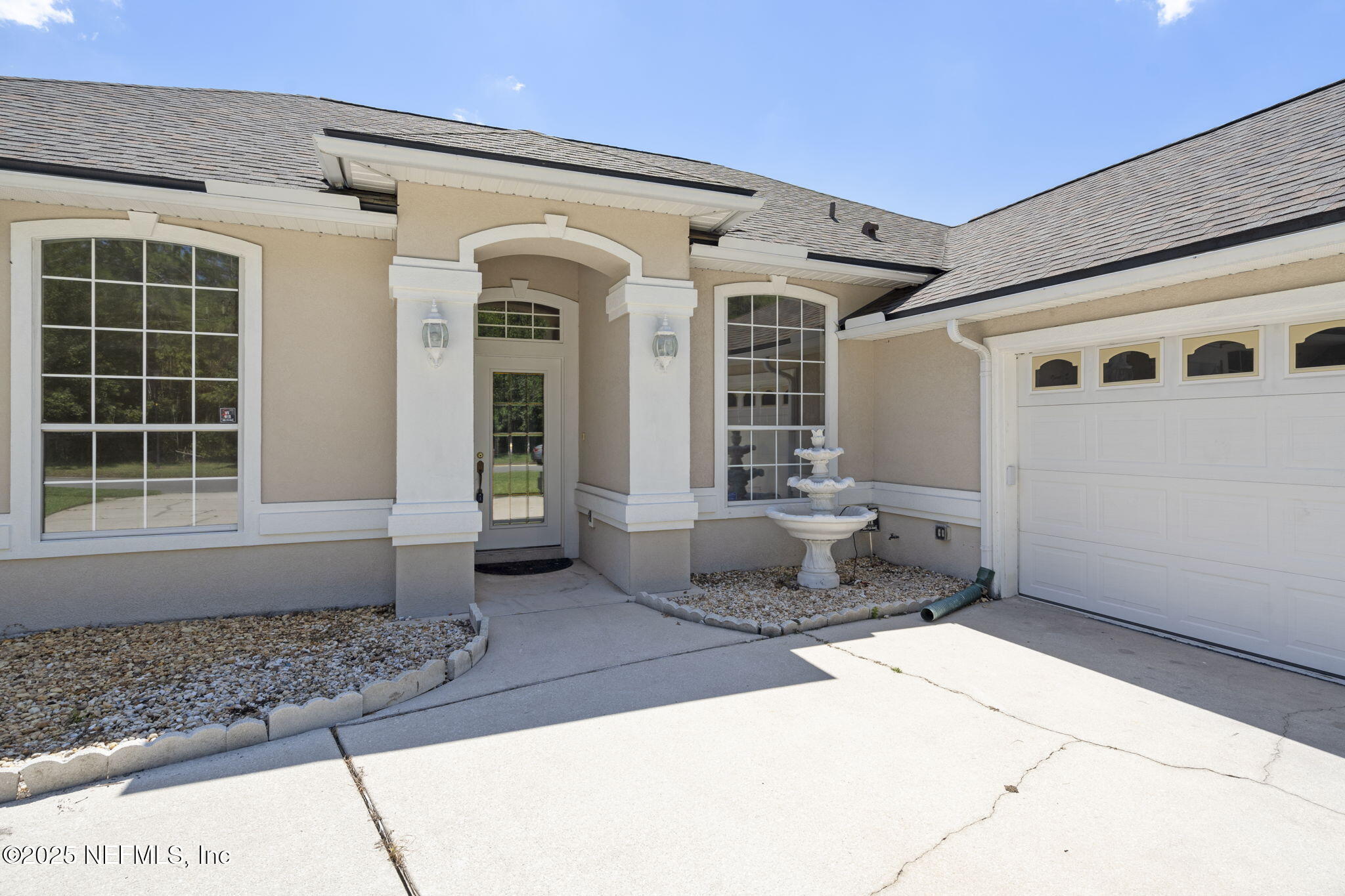 5673 Piper Glen Boulevard Jacksonville, FL 32222 - Photo 2 of 45 a front view of a house with windows