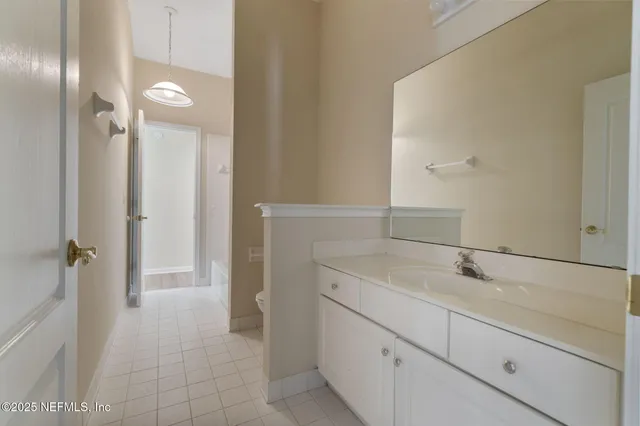 a bathroom with a sink and mirror