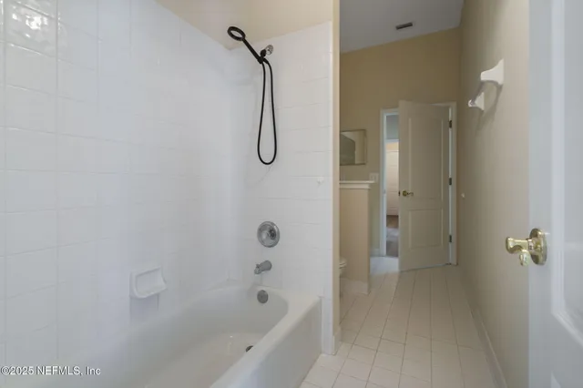 a bathroom with a shower and a bathtub