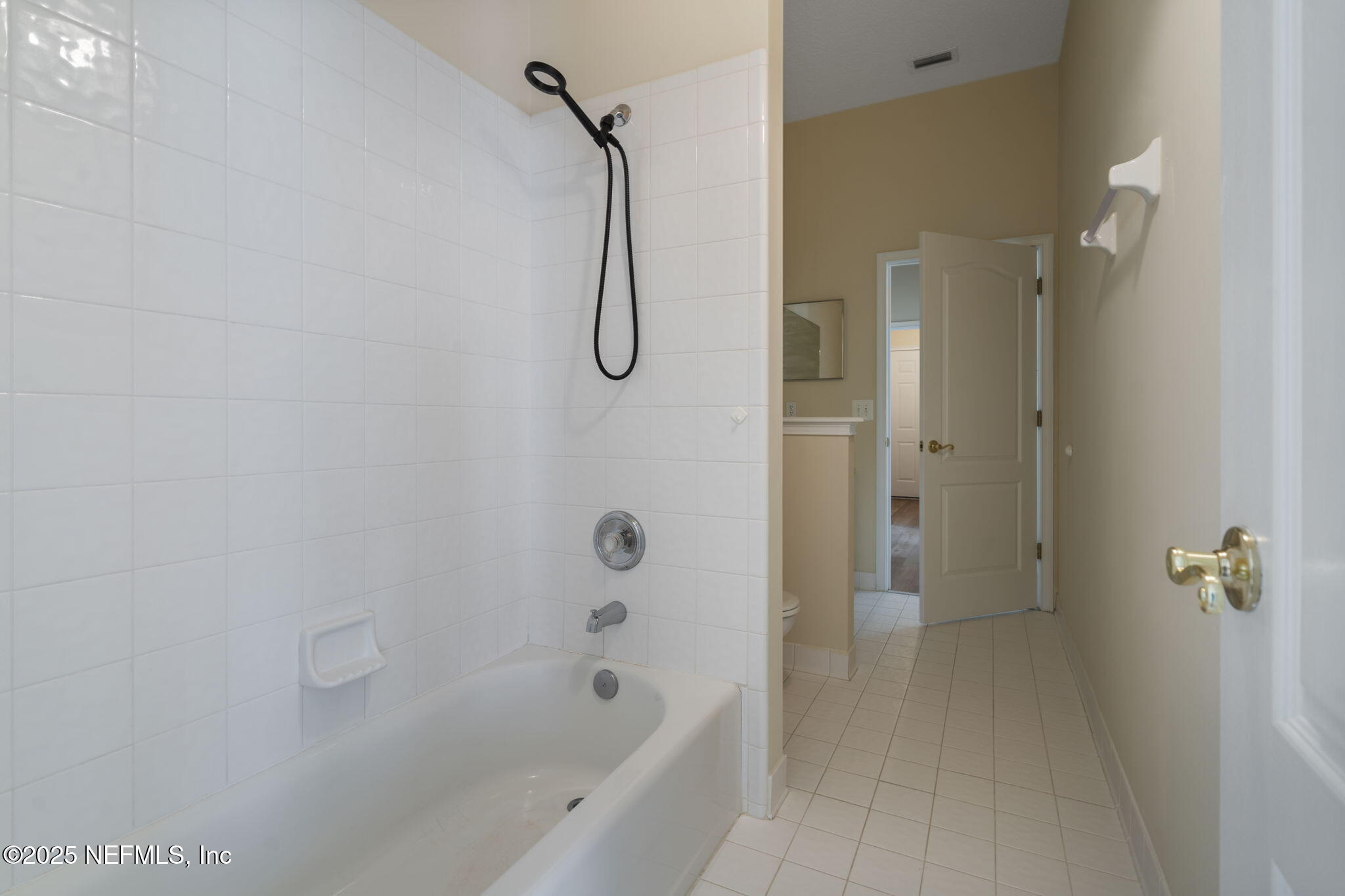 5673 Piper Glen Boulevard Jacksonville, FL 32222 - Photo 27 of 45 a bathroom with a shower and a bathtub