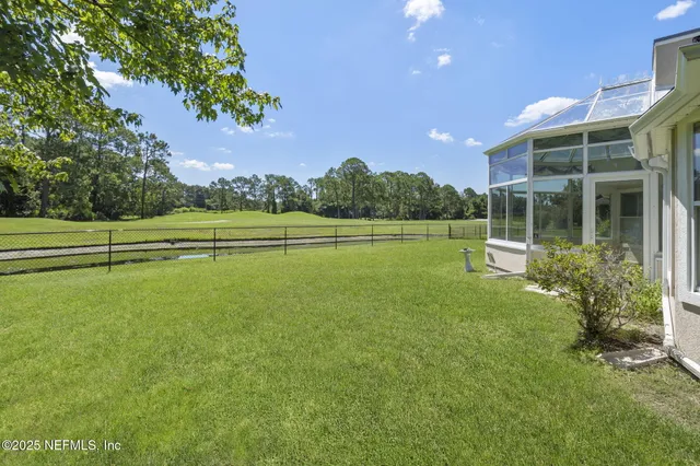 a view of a house with a big yard