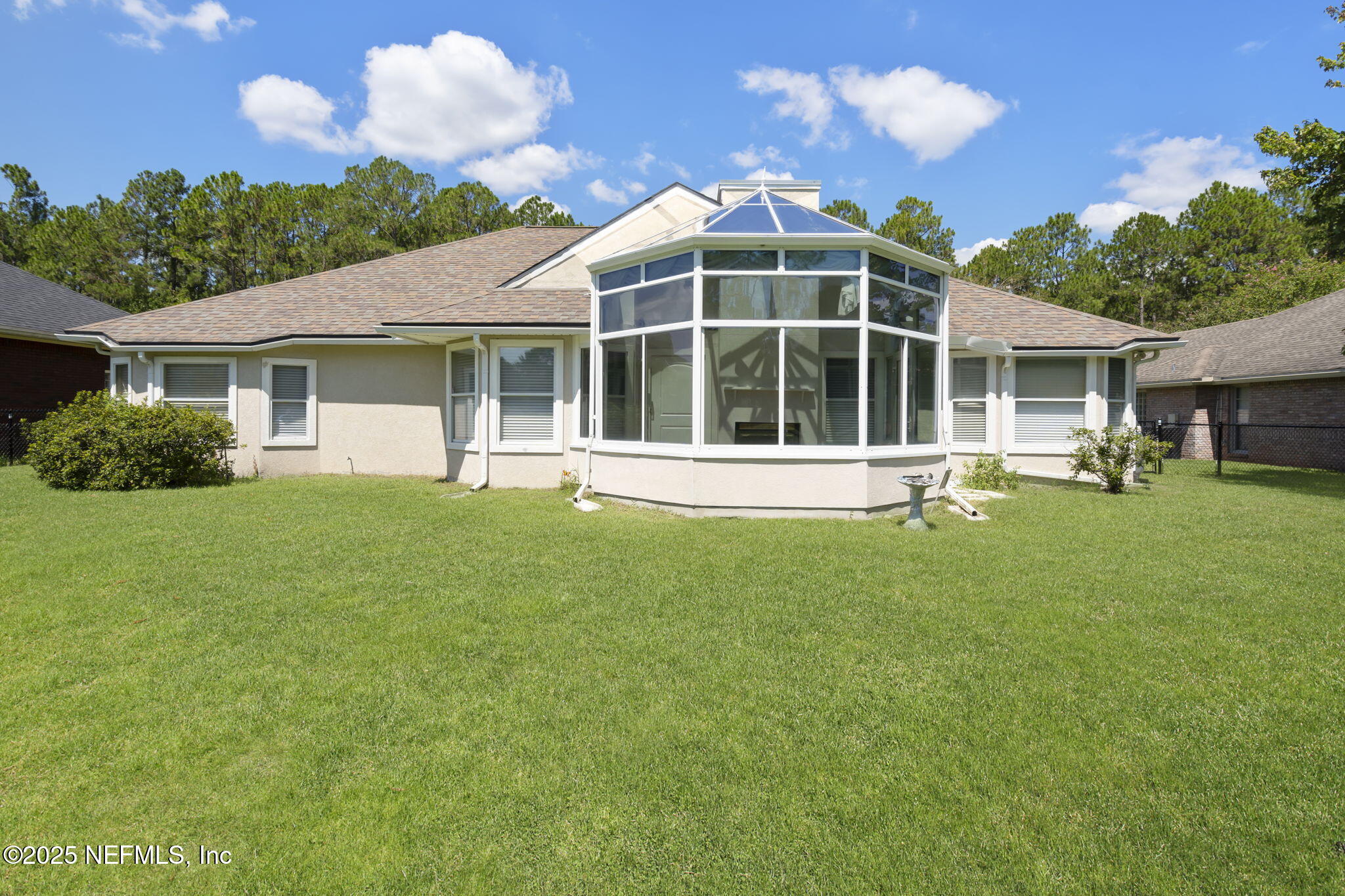 5673 Piper Glen Boulevard Jacksonville, FL 32222 - Photo 35 of 45 a front view of a house with a yard and green space