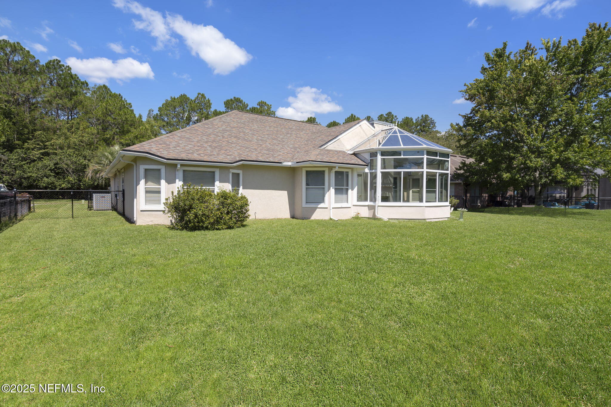 5673 Piper Glen Boulevard Jacksonville, FL 32222 - Photo 36 of 45 a front view of a house with a garden