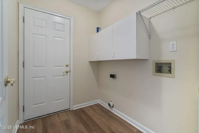 a view of room with hardwood floor