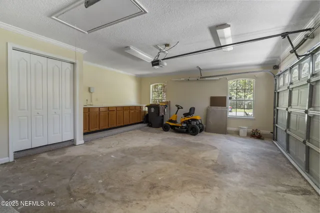 a view of a livingroom with furniture and a ceiling fan