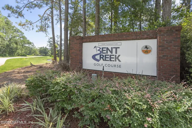 a sign that is on a brick wall