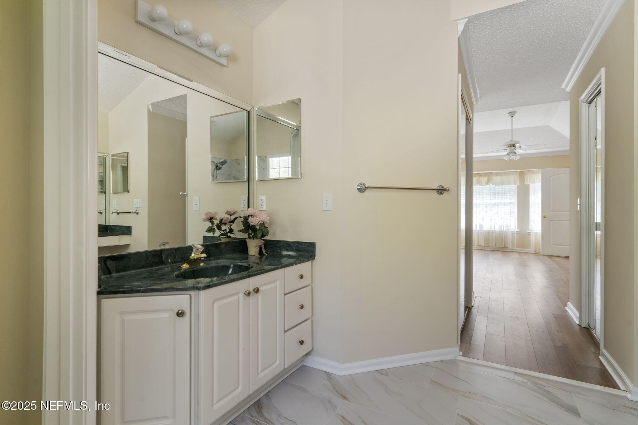 5673 Piper Glen Boulevard Jacksonville, FL 32222 - Photo 7 of 45 a bathroom with a sink and a mirror