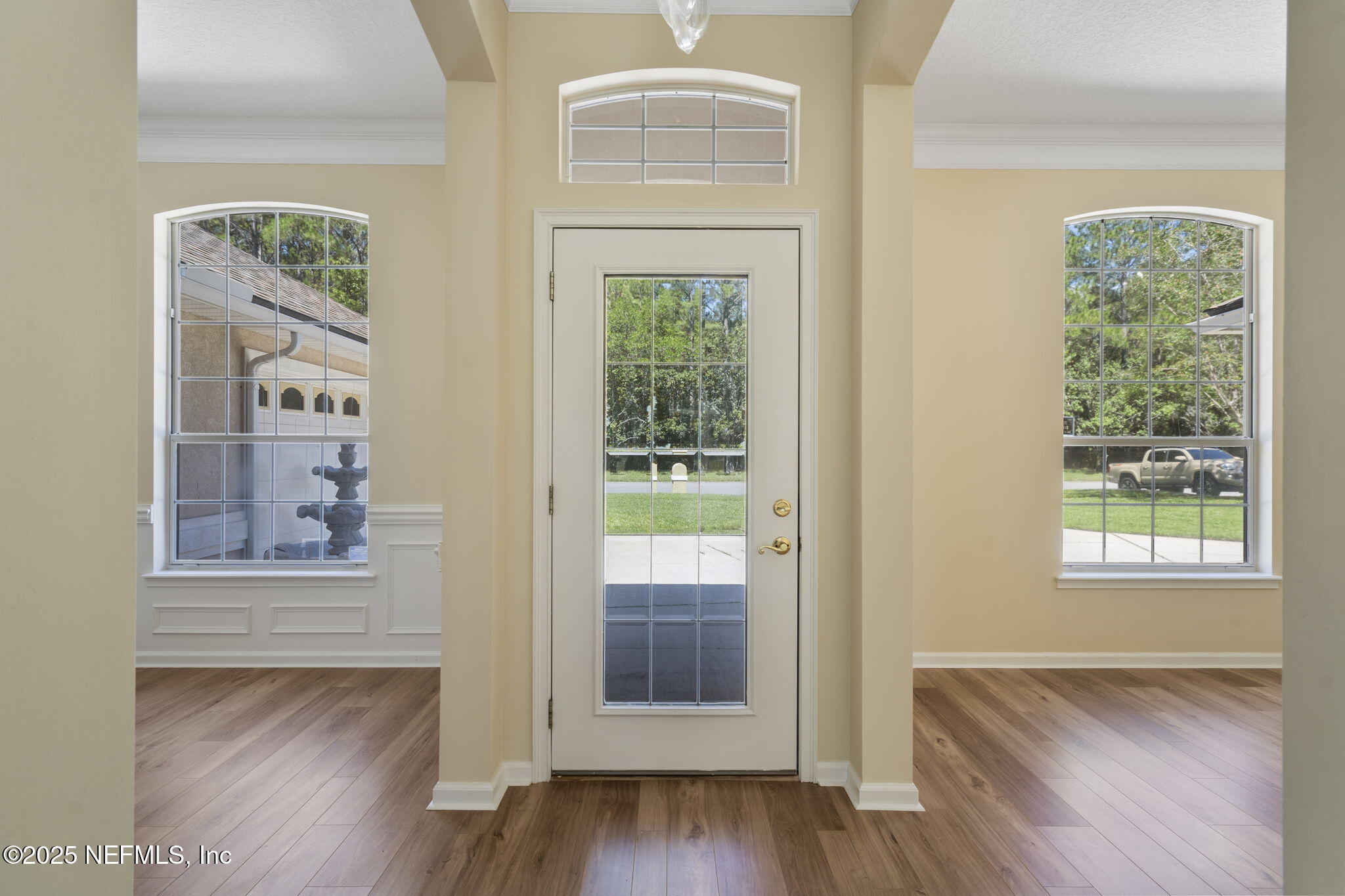 5673 Piper Glen Boulevard Jacksonville, FL 32222 - Photo 8 of 45 a view of an entryway with wooden floor