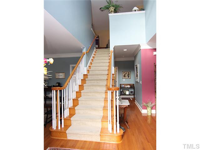 Main level has master bedroom & bath, an office, living rm, dining rm, family rm, kitchen & breakfast room.Up these steps is the loft/office,2 other bedrooms & bath. Other