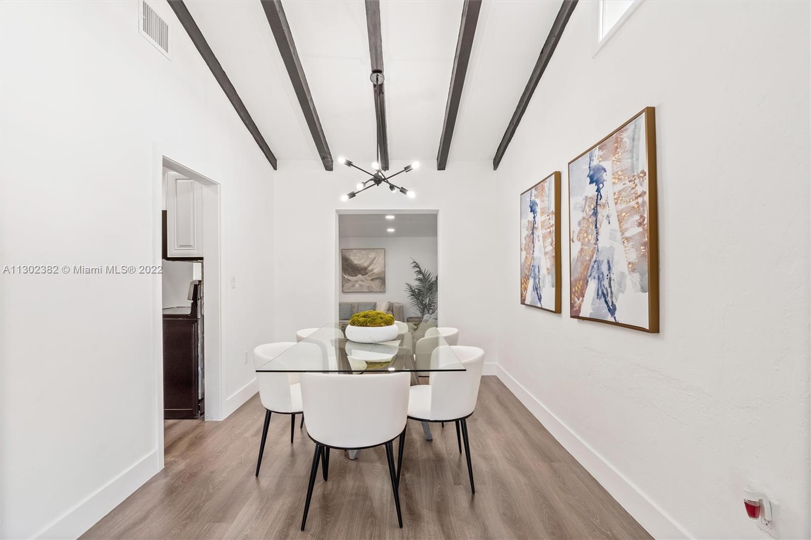 450 Flagami Boulevard Miami, FL 33144 - Photo 6 of 23 a view of a dining room with furniture and wooden floor