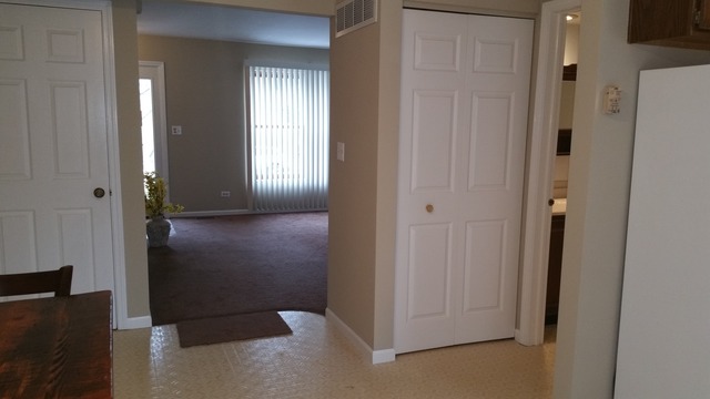 1409 Indiana Street, Unit 1409 St. Charles, IL 60174 - Photo 6 of 15 a view of a hallway with two rooms