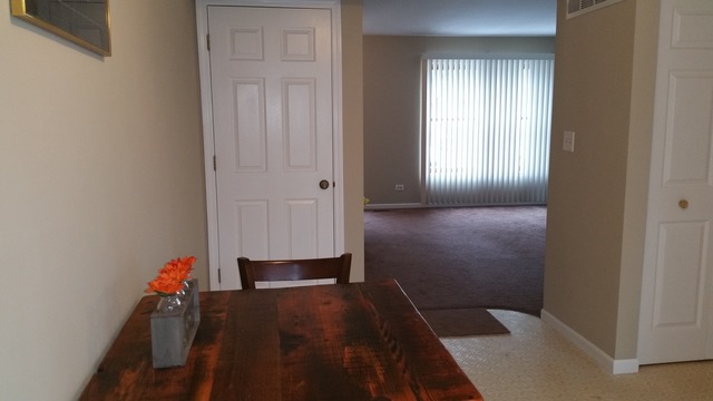 1409 Indiana Street, Unit 1409 St. Charles, IL 60174 - Photo 7 of 15 a view of a hallway with wooden floor and closet