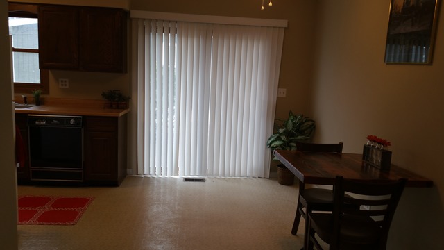 1409 Indiana Street, Unit 1409 St. Charles, IL 60174 - Photo 8 of 15 a dining room with furniture and window