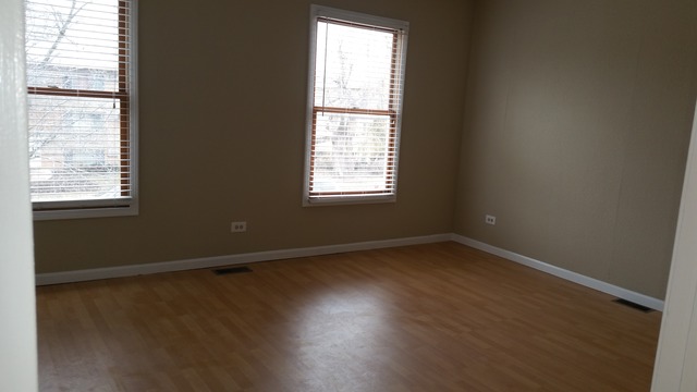 1409 Indiana Street, Unit 1409 St. Charles, IL 60174 - Photo 10 of 15 an empty room with wooden floor and windows