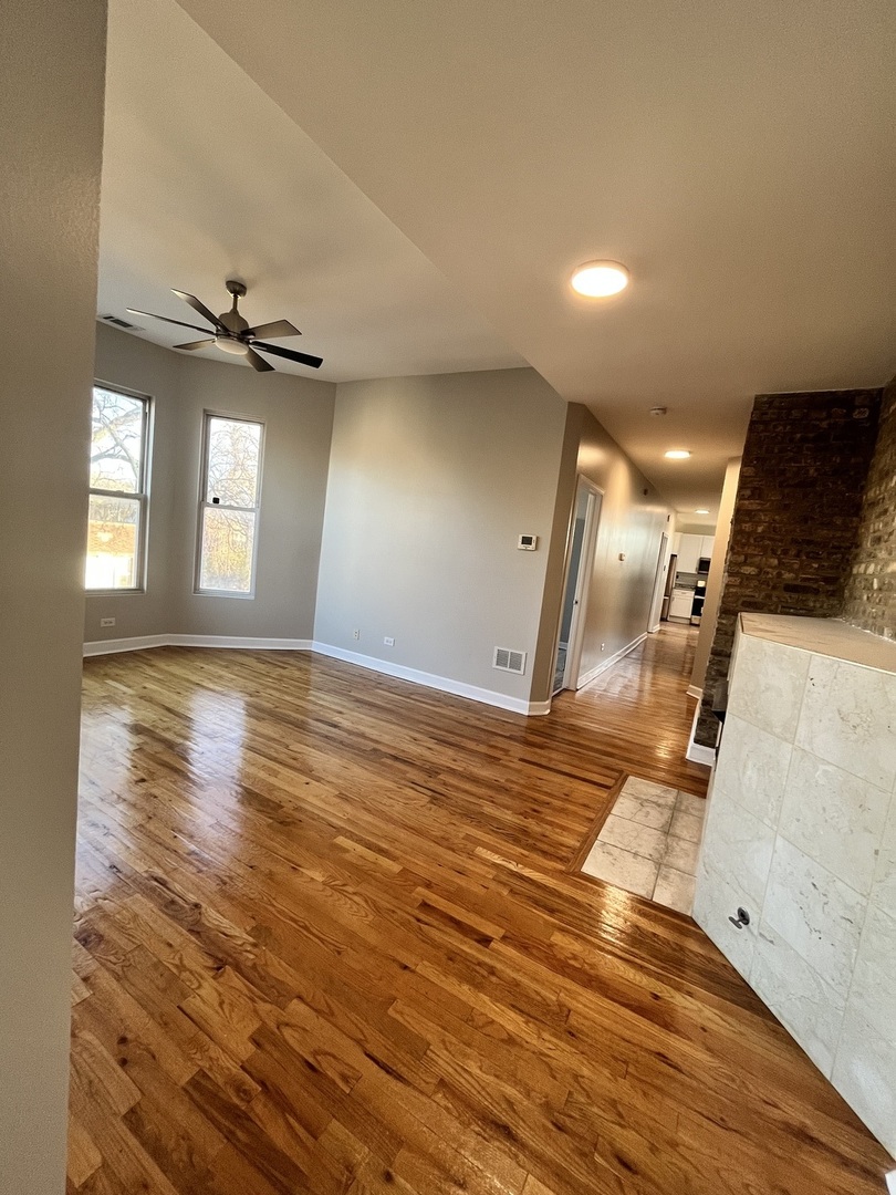501 West 60th Place, Unit 3 Chicago, IL 60621 - Photo 2 of 12 a view of a livingroom with a fireplace