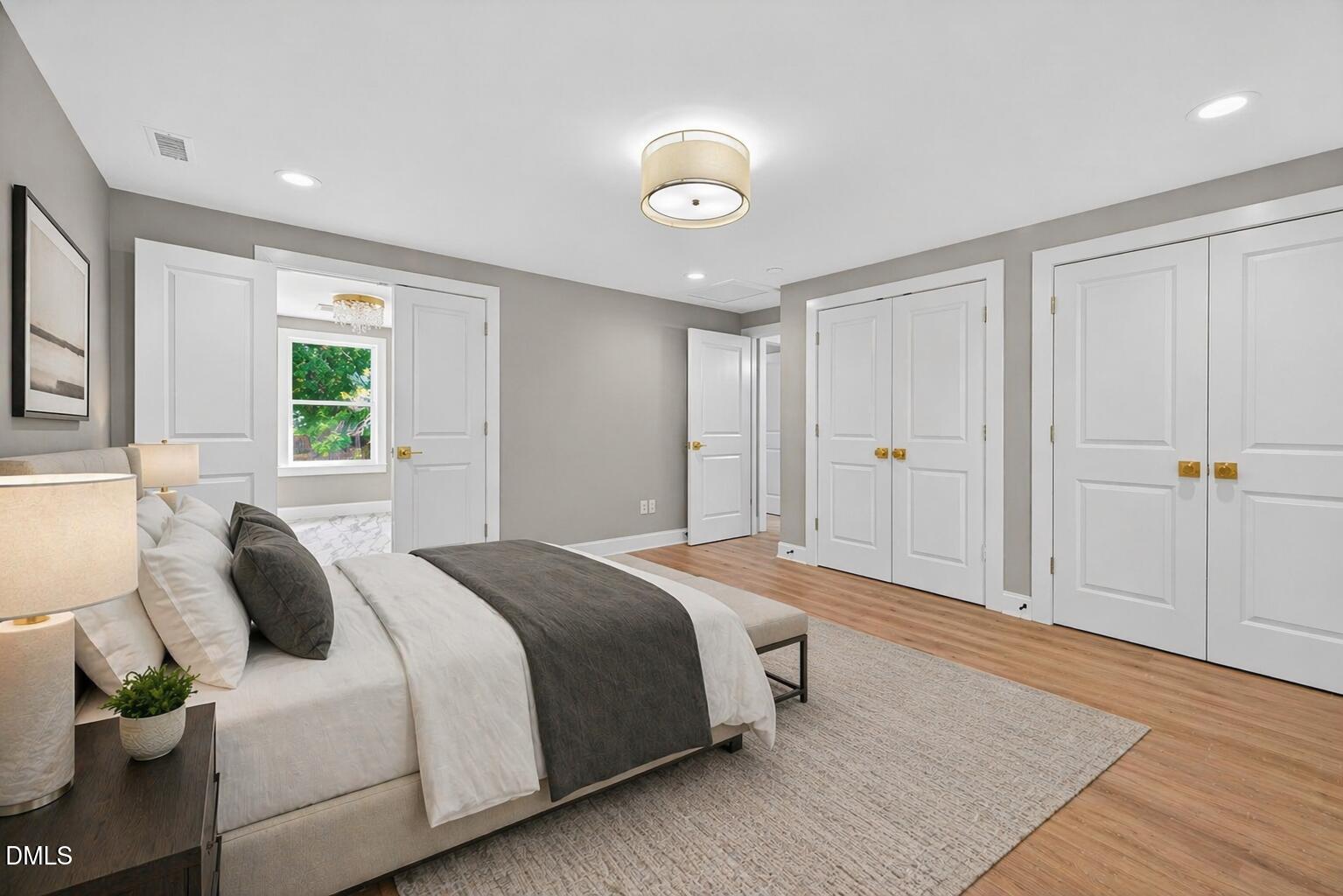 313 Crown Oaks Drive Raleigh, NC 27615 - Photo 16 of 60 a spacious bedroom with a bed and a window