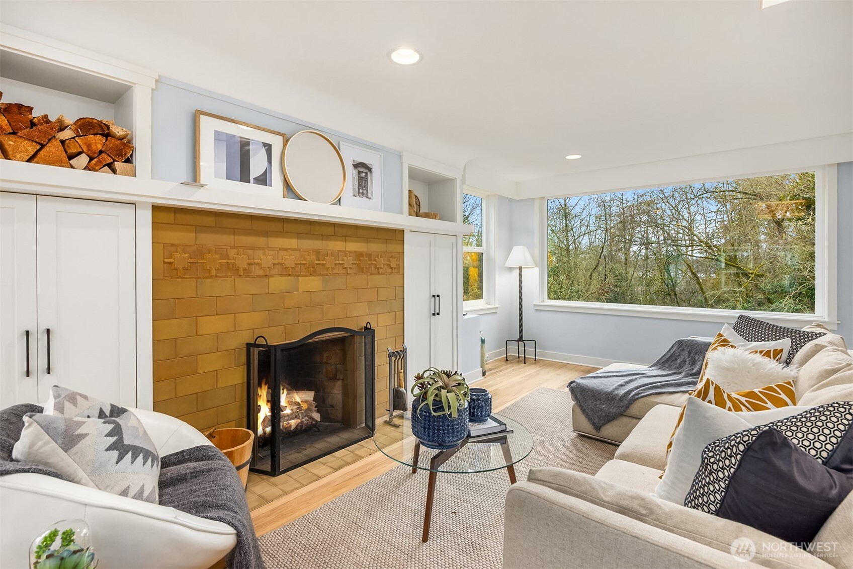 7204 Northeast Baker Hill Road Bainbridge Island, WA 98110 - Photo 11 of 40 a living room with furniture and a fireplace