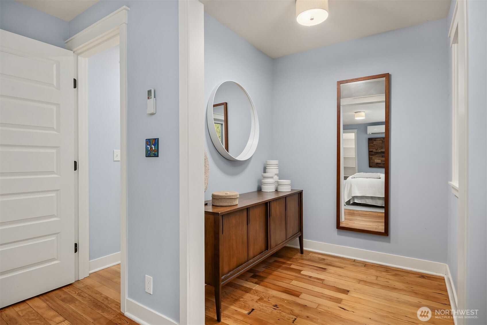 7204 Northeast Baker Hill Road Bainbridge Island, WA 98110 - Photo 19 of 40 a view of an entryway with wooden floor