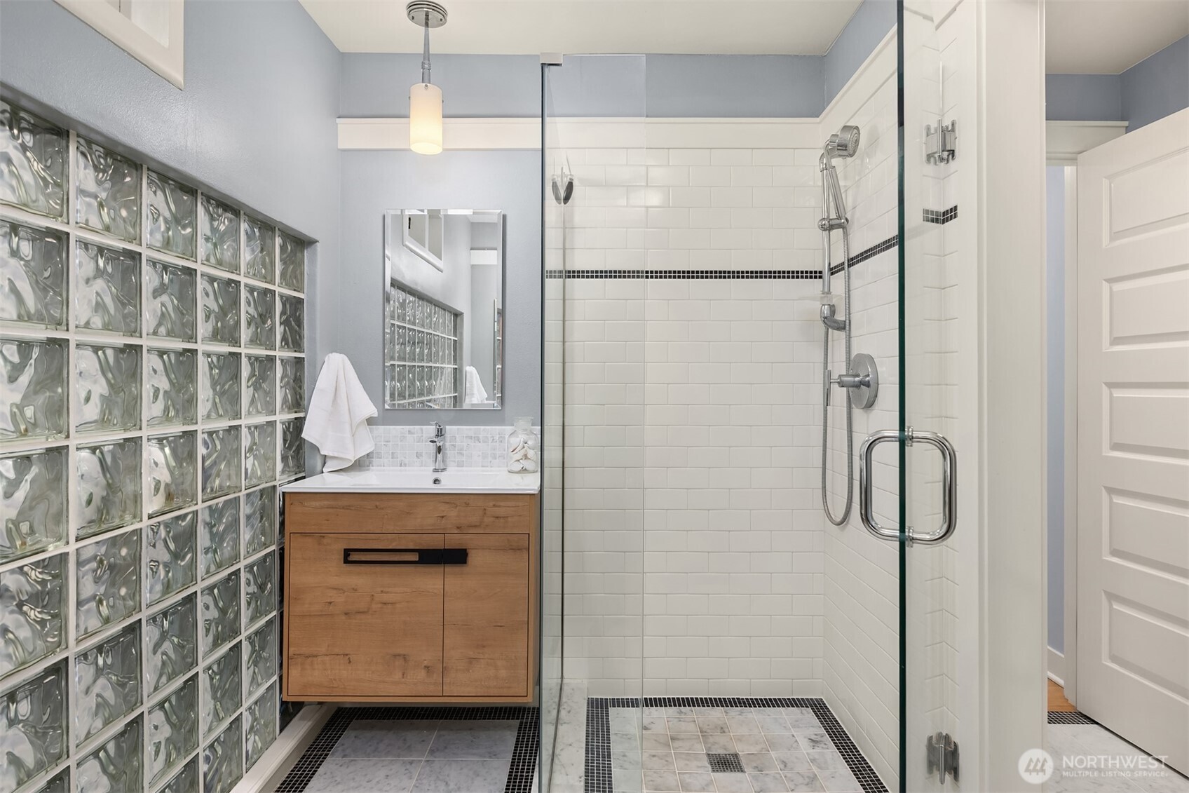 7204 Northeast Baker Hill Road Bainbridge Island, WA 98110 - Photo 21 of 40 a bathroom with a shower and a sink