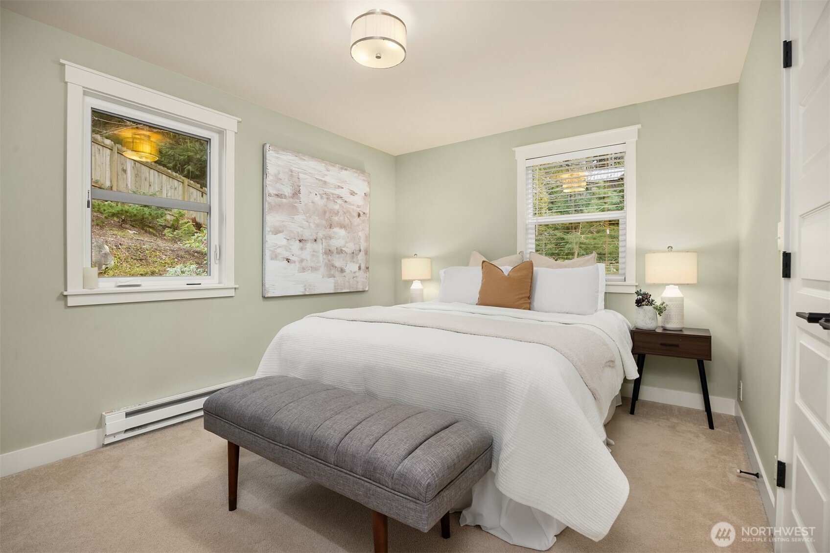 7204 Northeast Baker Hill Road Bainbridge Island, WA 98110 - Photo 23 of 40 a bedroom with a bed and a large window
