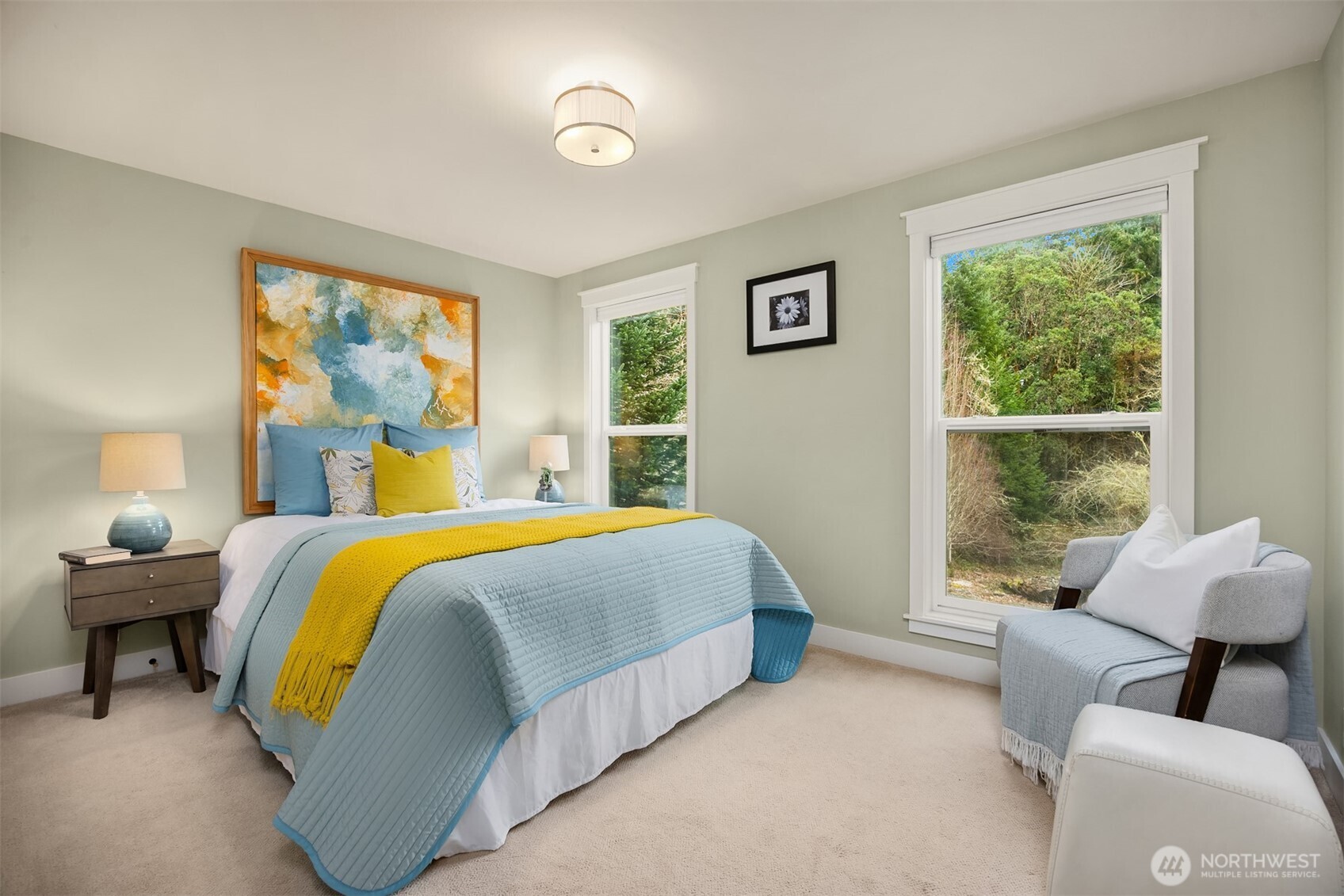 7204 Northeast Baker Hill Road Bainbridge Island, WA 98110 - Photo 25 of 40 a bedroom with a bed and a couch