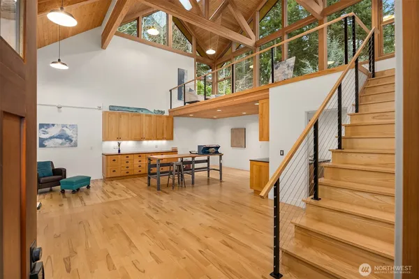 a view of entryway and hall with wooden floor