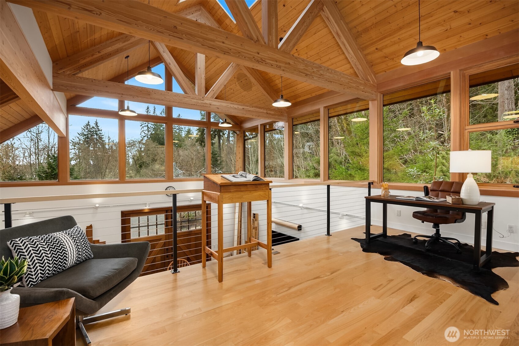 7204 Northeast Baker Hill Road Bainbridge Island, WA 98110 - Photo 36 of 40 a bedroom with furniture and large windows