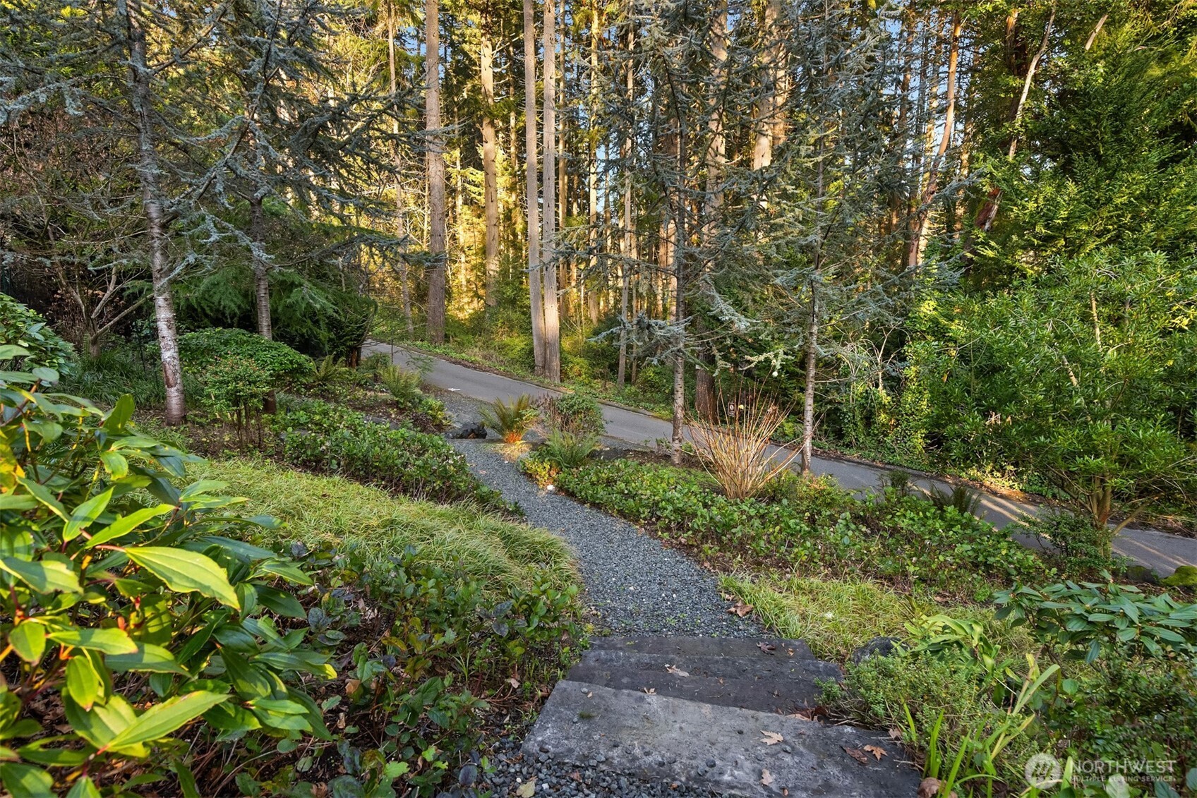 7204 Northeast Baker Hill Road Bainbridge Island, WA 98110 - Photo 37 of 40 a view of a garden with trees