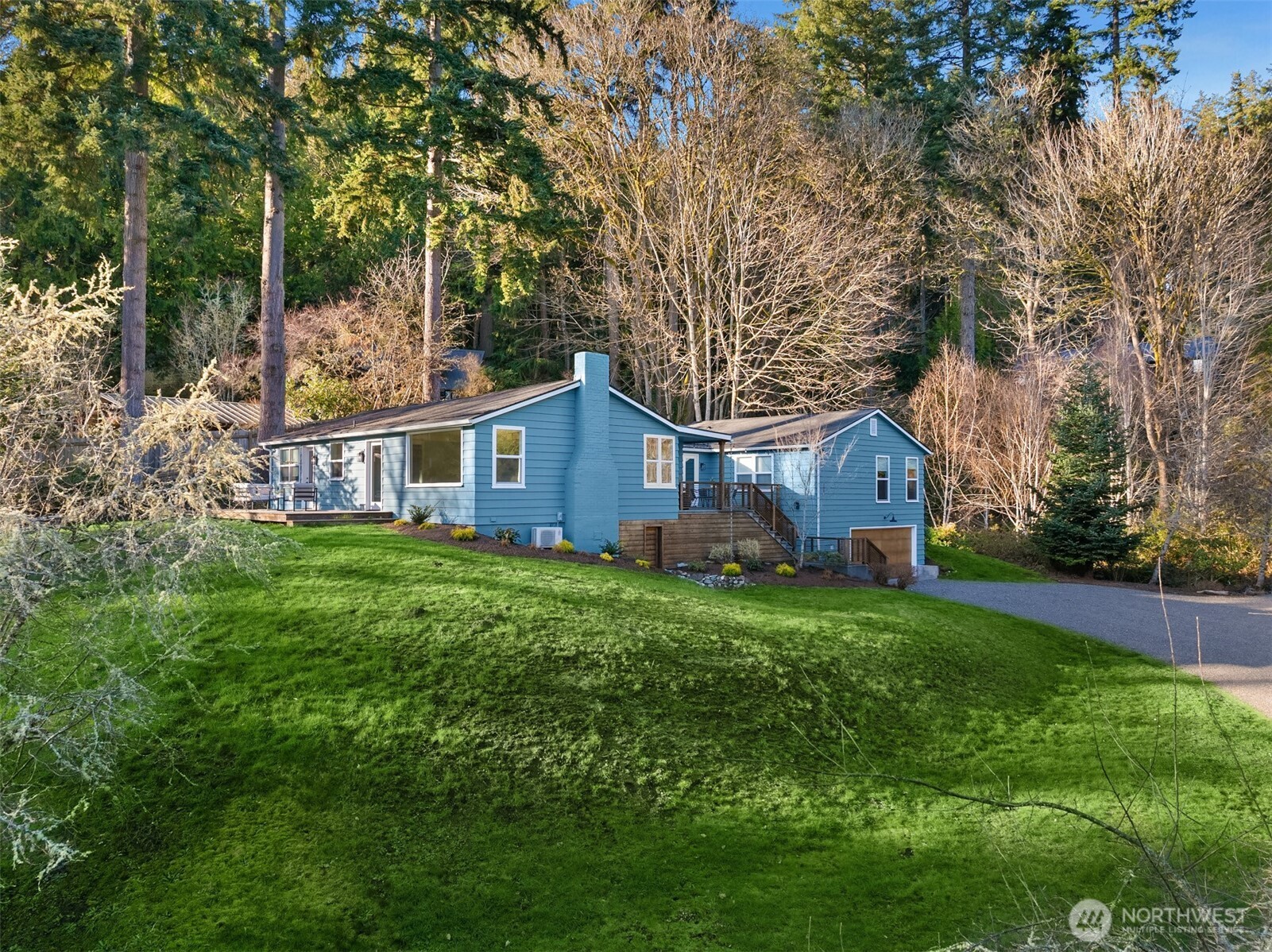 7204 Northeast Baker Hill Road Bainbridge Island, WA 98110 - Photo 5 of 40 a view of a house with backyard and garden
