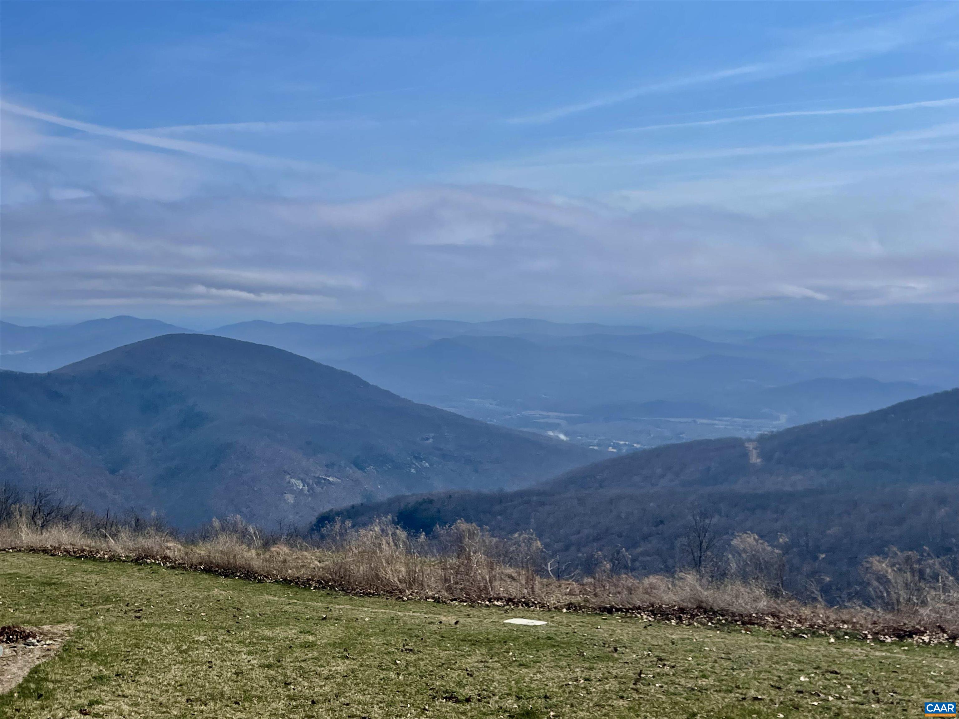 1613 Overlook Condos Roseland, VA 22967 - Photo 1 of 35 a view of an ocean beach and mountain