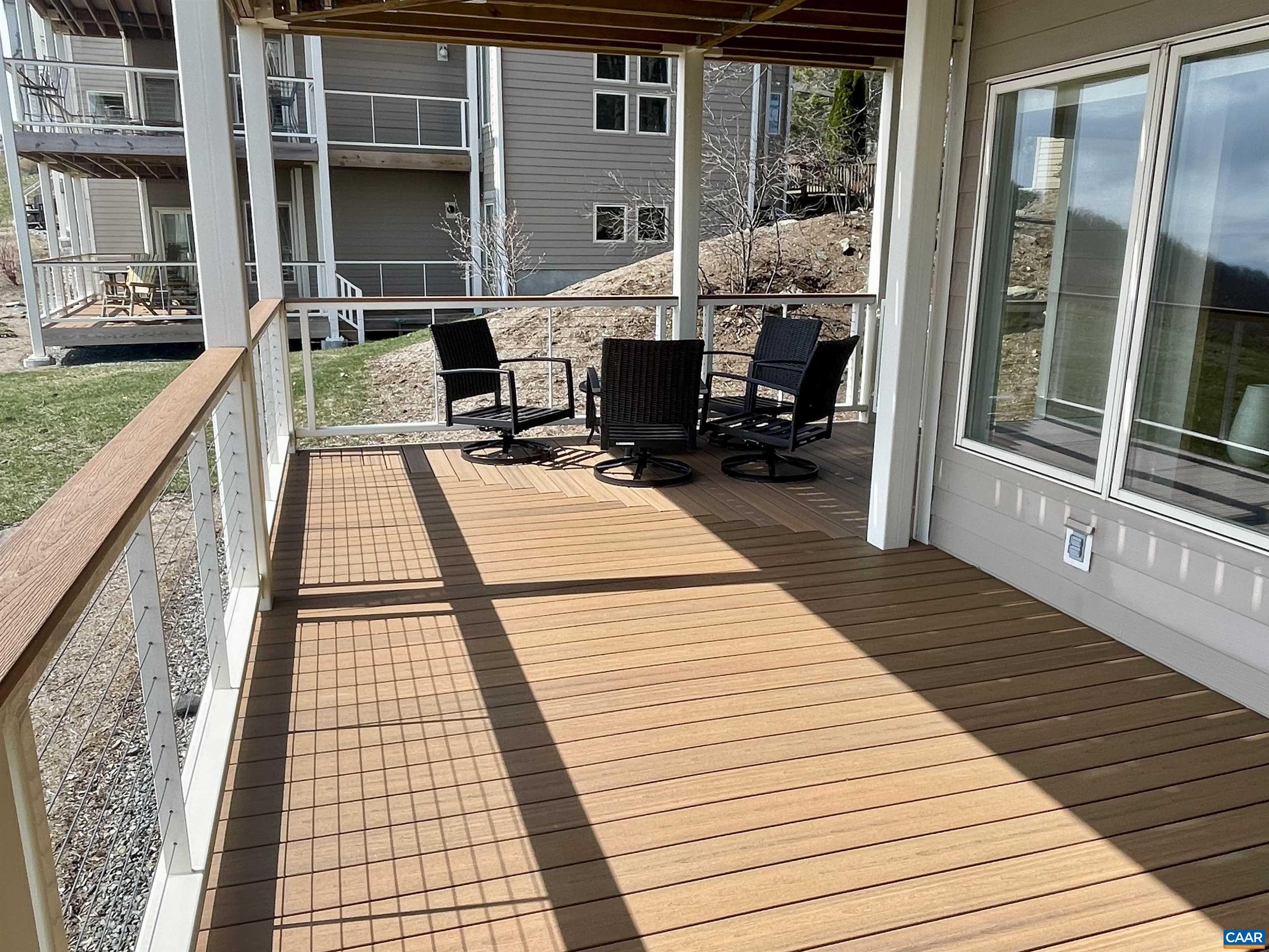 1613 Overlook Condos Roseland, VA 22967 - Photo 16 of 35 a balcony with wooden floor and furniture