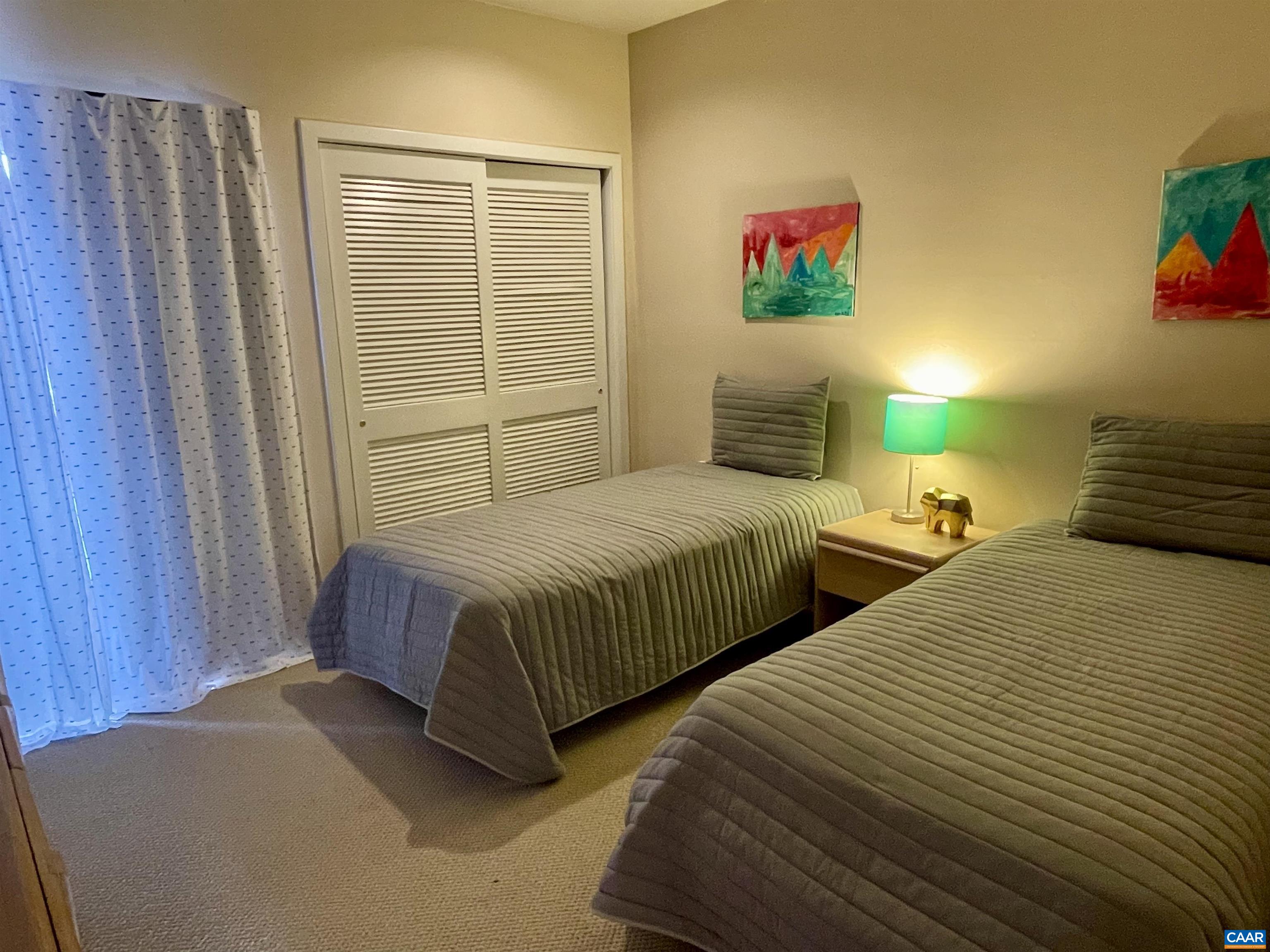 1613 Overlook Condos Roseland, VA 22967 - Photo 26 of 35 a bedroom with two beds and a window