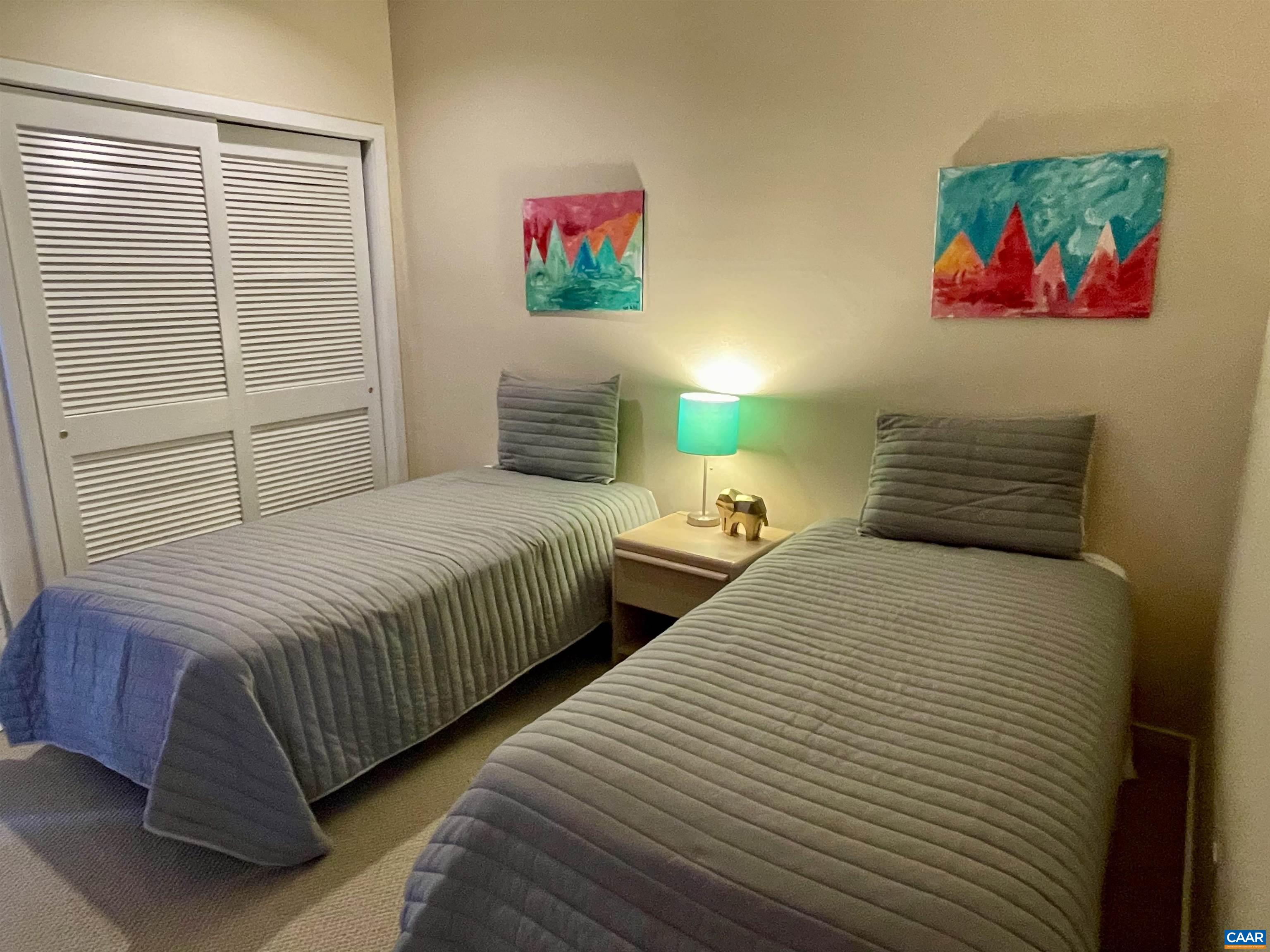 1613 Overlook Condos Roseland, VA 22967 - Photo 27 of 35 a bedroom with two beds and painting on the wall