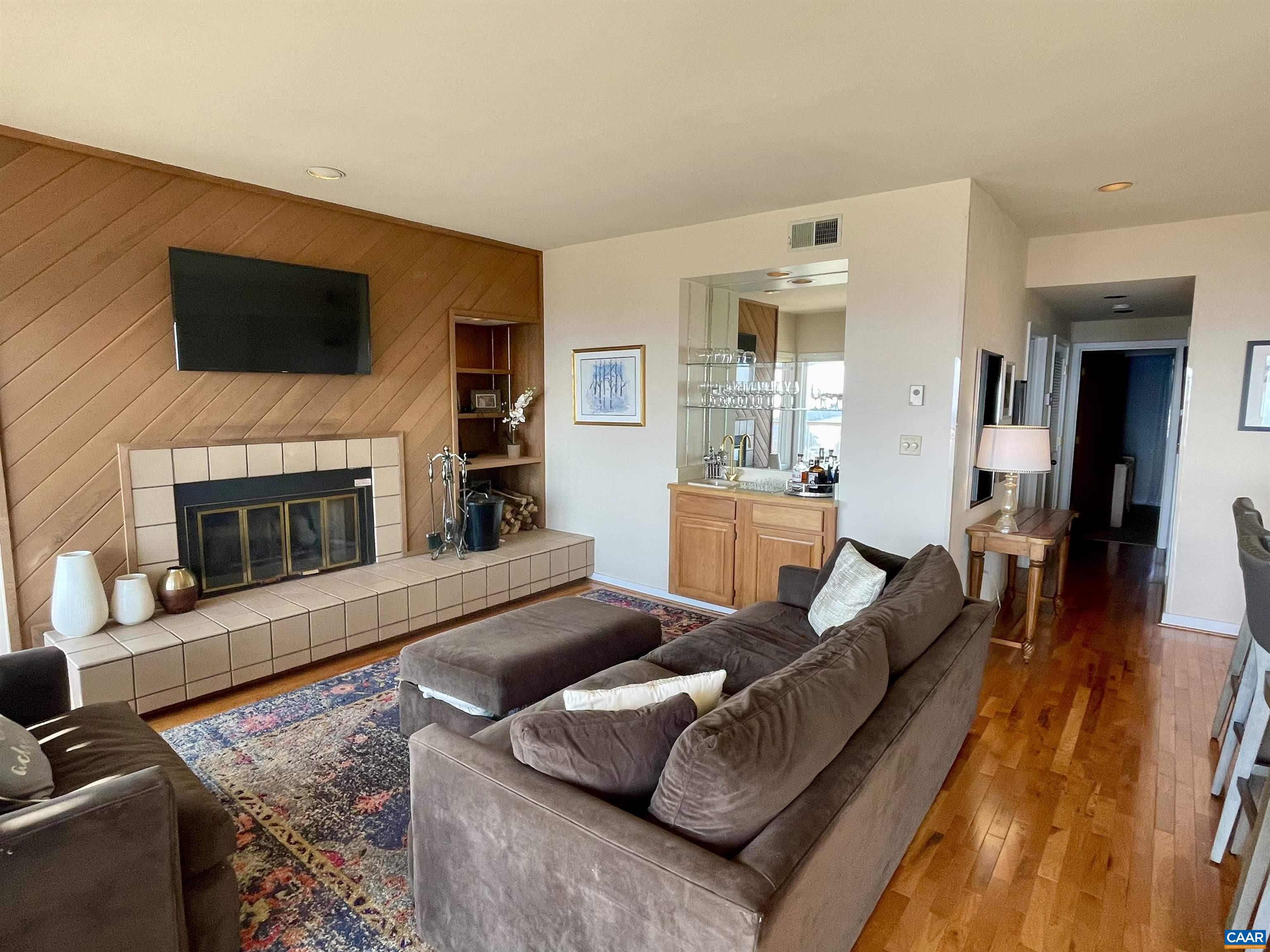 1613 Overlook Condos Roseland, VA 22967 - Photo 6 of 35 a living room with furniture and a flat screen tv