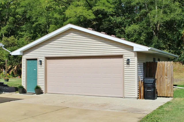 a view of house with a garage