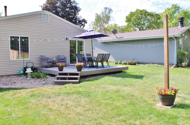 a backyard of a house with seating space
