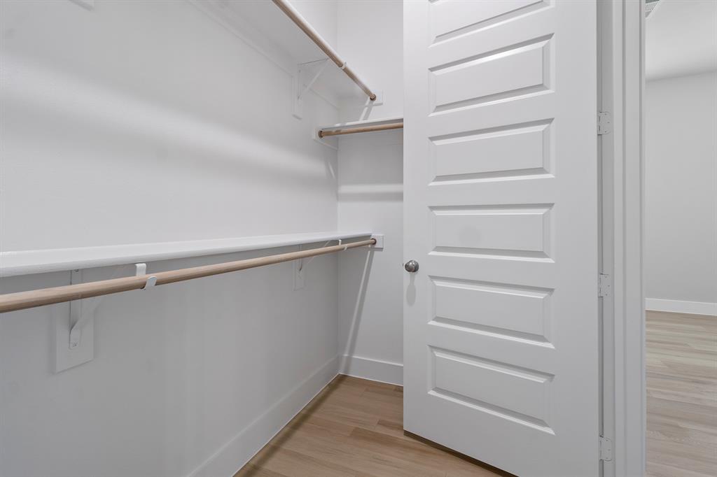 8218 Idyllic Place McKinney, TX 75071 - Photo 14 of 24 a view of walk in closet with empty racks