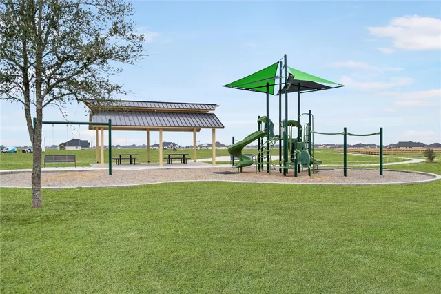 a view of outdoor space with garden and trees