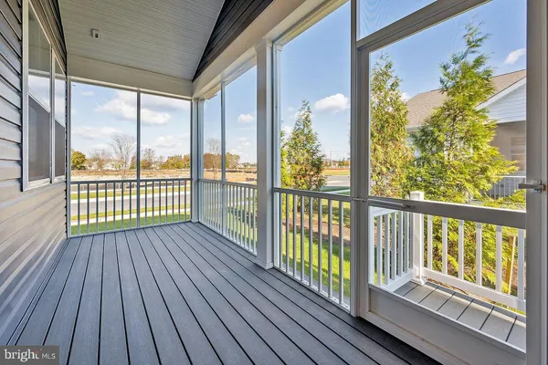a view of a wooden balcony with wooden floor