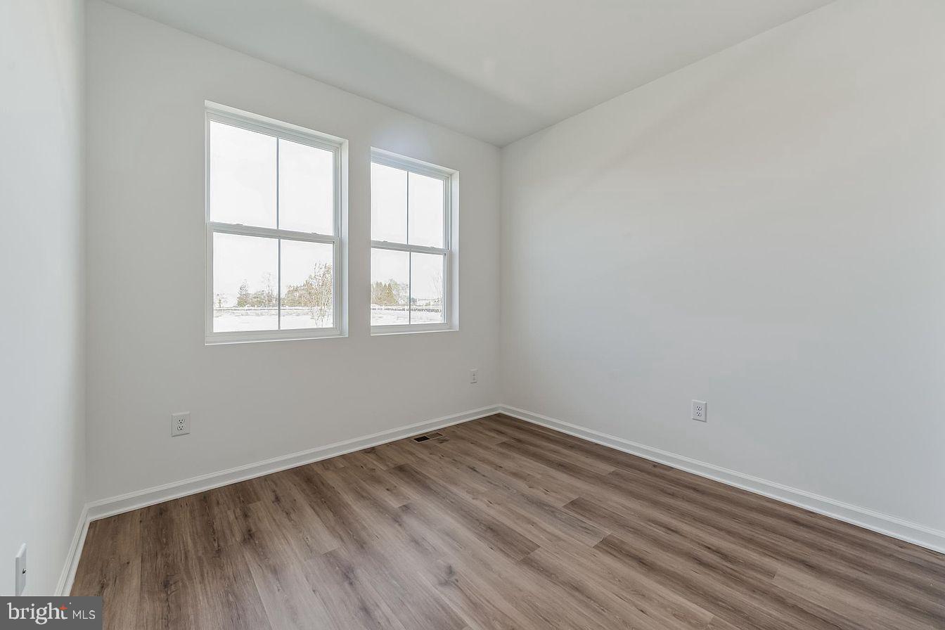 23506 Reed Grass Way Millville, DE 19970 - Photo 15 of 15 an empty room with a window