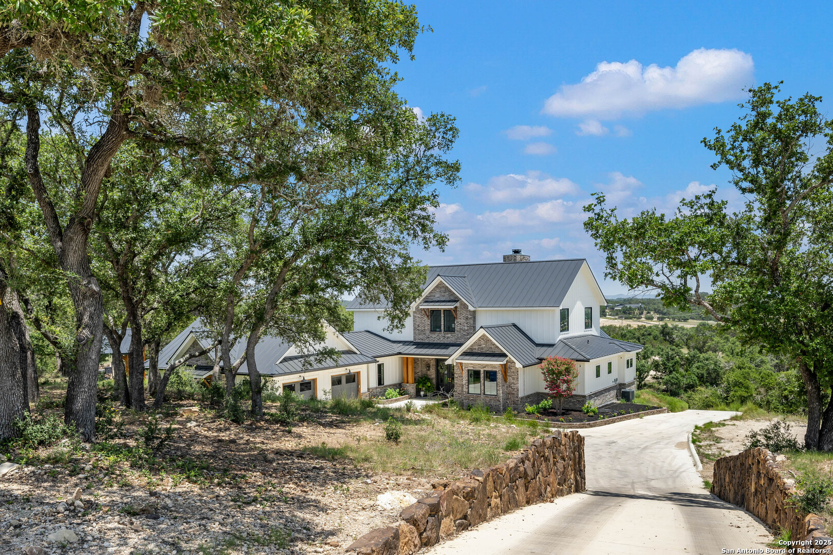 324 Ridge Point Spring Branch, TX 78070 - Photo 3 of 50 a front view of a house with garden