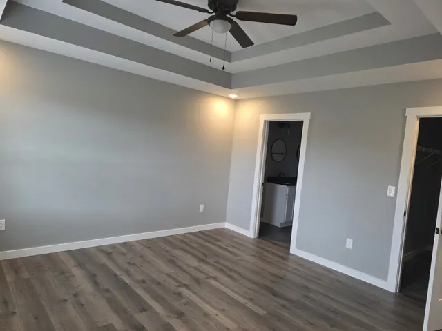 a view of room with window and hardwood floor