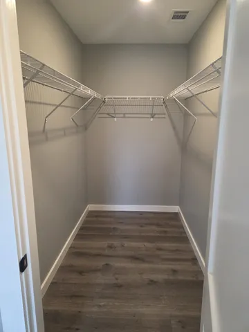 a view of an empty walk in closet