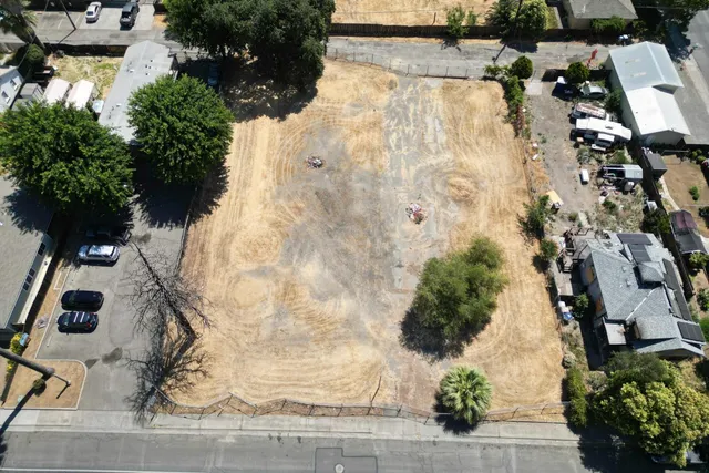 an aerial view of residential house with parking space