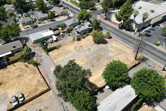 an aerial view of residential houses with outdoor space